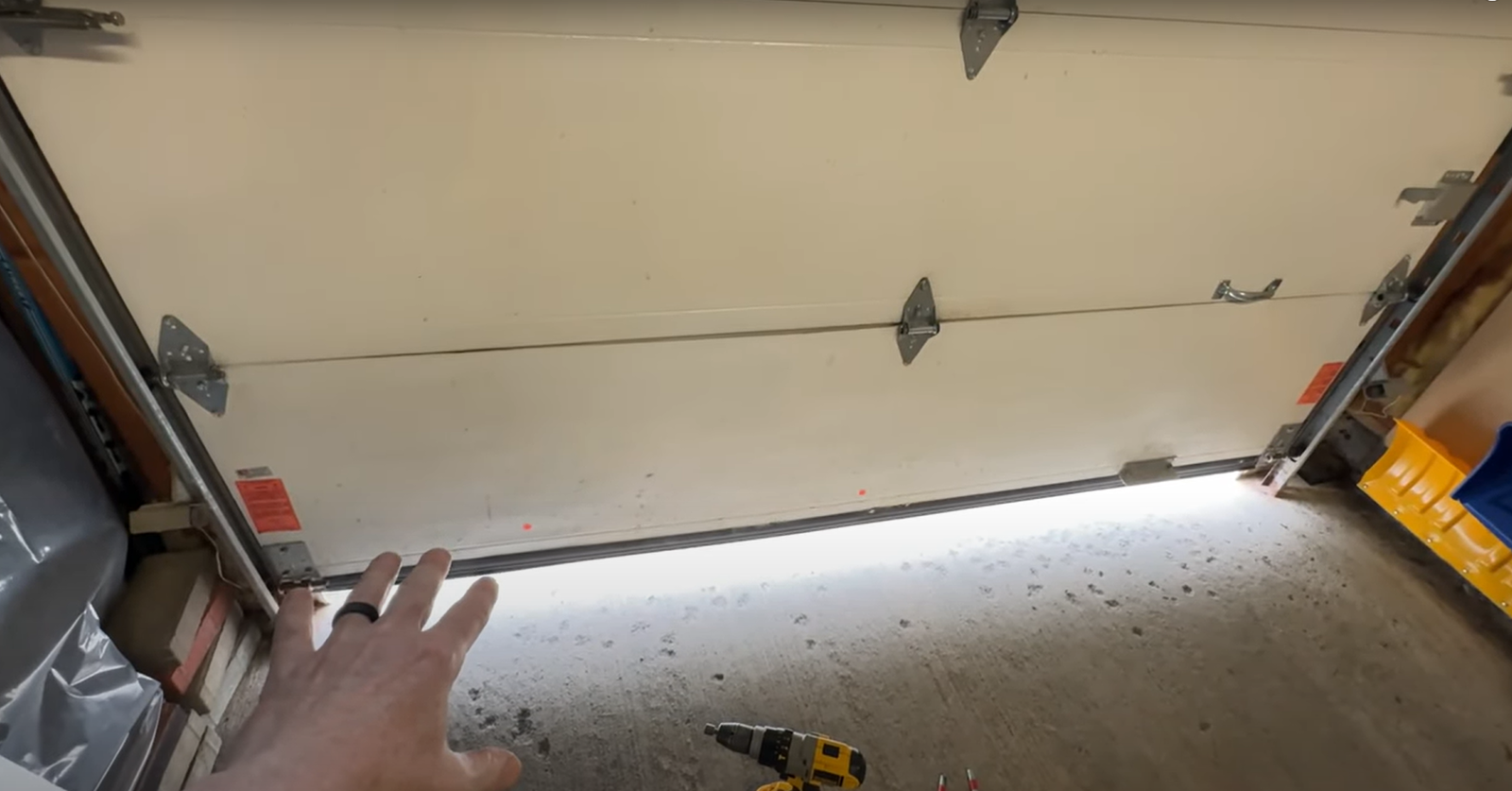 White panel garage door with windows being replaced on a two-car garage"v