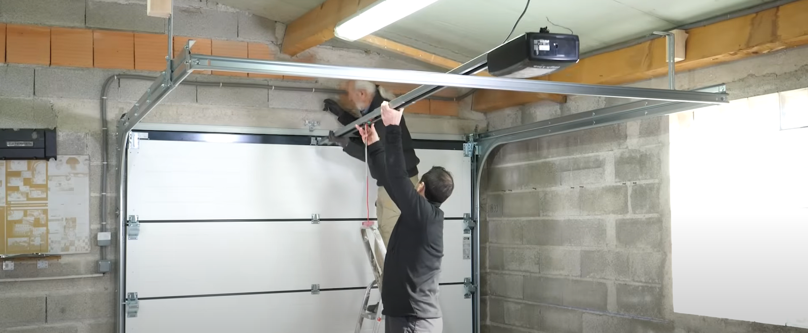 Professional technician repairing a garage door opener in Sapphire Shores for garage door repair services.